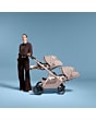 1161099110_F5_2026_maxicosi_stroller_oxfordflexseat_oaktruffle_momposingnexttostrollertwintoddlerslieflatmode