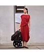 1518084110_F9_2026_maxicosi_stroller_oxfordcarrycot_espressobrown_lifestyle_strollerfoldeduprightwithmom